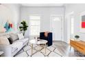 Bright and airy living room with modern furnishings, stylish rug and decor throughout at 635 Alpine Ave, Boulder, CO 80304