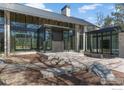 Striking modern home exterior with large windows, sleek lines, and professionally landscaped grounds at 775 Kalmia Ave, Boulder, CO 80304