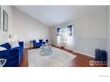 Bright living room featuring hardwood floors, stylish furniture, and ample natural light at 12510 Newton St, Broomfield, CO 80020