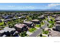 Picturesque aerial view of a neighborhood nestled among lush trees and winding streets at 1440 Eversole Dr, Broomfield, CO 80023