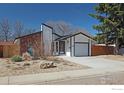 Charming single-Gathering home with an attached garage, landscaped front yard, and inviting curb appeal at 1517 Atwood St, Longmont, CO 80501