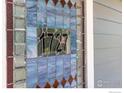 Close-up of the stained glass window with house number 1727 and geometric designs at 1727 Mapleton Ave, Boulder, CO 80304