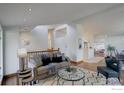 Inviting living room features hardwood floors, a neutral color palette and a modern staircase at 1880 Kohler Dr, Boulder, CO 80305