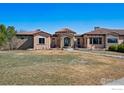 Beautiful single-story home with a tile roof and a well-manicured front yard at 2102 Shoreside Dr, Berthoud, CO 80513