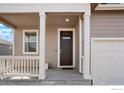 Close-up of front porch and front door at 2372 Mountain Sky Dr, Fort Lupton, CO 80621