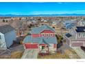 An aerial shot of the beautiful home in a quiet neighborhood with stunning mountain views at 6140 Ralston St, Frederick, CO 80530