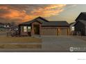 Charming single-Gathering home with a three-car garage, and stone masonry at 692 Biscayne Ct, Berthoud, CO 80513