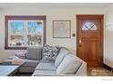 Cozy living room featuring a comfortable sectional sofa and warm wooden trim at 819 9Th St, Boulder, CO 80302