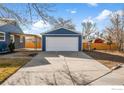 Detached garage with a wide driveway and well maintained backyard at 895 Oswego St, Aurora, CO 80010