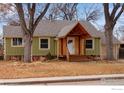 Inviting single-Gathering home featuring a wood-shingled gable and a well-maintained front lawn at 1113 Collyer St, Longmont, CO 80501