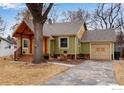 Quaint single-Gathering home with a wood-shingled gable, driveway, and garage at 1113 Collyer St, Longmont, CO 80501