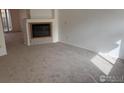 Bright living room with fireplace and neutral carpet at 1339 Sumner St # B, Longmont, CO 80501