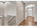 Light-filled entryway with hardwood floors and neutral walls leading to a bright, inviting home at 17012 Lipan St, Broomfield, CO 80023