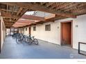 This photo shows the garage with parking for bicycles and covered access to unit doors at 1800 Pearl St # 12, Boulder, CO 80302