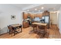 Well-equipped kitchen featuring stainless steel appliances and a granite-topped island with seating at 1950 N Logan St # 502, Denver, CO 80203