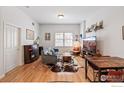 Bright and airy living room with a decorative rug, modern furniture, and a media center at 1950 N Logan St # 502, Denver, CO 80203