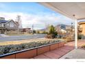 Charming home featuring a cozy front porch with stunning mountain views in the distance at 2003 Balsam Dr, Boulder, CO 80304