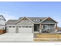 Charming single-Gathering home featuring stone accents, a three-car garage, and a cozy front porch at 213 Rocking Chair Dr, Berthoud, CO 80513