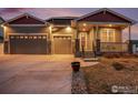 Beautiful home featuring a three-car garage and covered front porch with great curb appeal at 2161 Cadman St, Berthoud, CO 80513