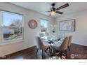 Bright dining room with hardwood floors and natural light from the exterior windows at 339 S Hoover Ave, Louisville, CO 80027