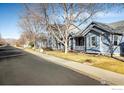 Street showcasing well-maintained homes and landscape with trees at 4004 Ravenna Pl, Longmont, CO 80503