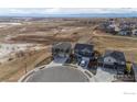 Aerial view of houses, lawns, and open space at 4401 Garnet Way, Mead, CO 80504