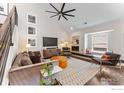 Sophisticated living room with contemporary furnishings, fireplace, and large windows for natural light at 4475 Laguna Pl # 309, Boulder, CO 80303