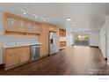 Kitchen and living area with wood floors and a stainless steel refrigerator at 500 Mohawk Dr # 510, Boulder, CO 80303