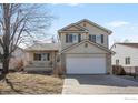 Charming two-story home features a front porch and attached two-car garage at 5366 Badger Ln, Frederick, CO 80504