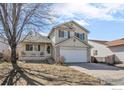 Charming two-story home features a front porch and attached two-car garage at 5366 Badger Ln, Frederick, CO 80504