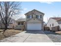 Charming two-story home features a front porch and attached two-car garage at 5366 Badger Ln, Frederick, CO 80504