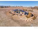 Beautiful home with a large deck, solar panels, and an outdoor hot tub, set on expansive acreage at 11251 Lookout Dr, Longmont, CO 80504