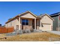 Well-maintained single-Gathering home with a two-car garage and inviting front porch at 1799 Jade Ave, Brighton, CO 80603