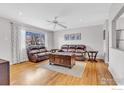 Well-lit living room with hardwood floors and comfortable leather couches at 3090 Euclid Ave, Boulder, CO 80303