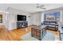 Inviting living room featuring hardwood floors, large window, and comfortable seating at 3090 Euclid Ave, Boulder, CO 80303