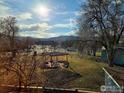 Scenic backyard view with a gazebo and trees, creating a peaceful outdoor space and mountain views at 3671 Pinedale St # G, Boulder, CO 80301