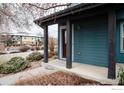 Charming front porch of a townhome with dark wood supports and a well-manicured lawn at 3671 Pinedale St # G, Boulder, CO 80301