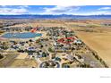 An aerial view of the community highlighting the home's proximity to Mulligan Lake at 109 Blue Heron Ct, Mead, CO 80542