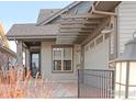 Exterior view of the home showcasing the attached garage and covered entry at 1160 Summit View Dr, Louisville, CO 80027