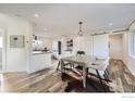 Open dining area with a wooden table, modern chairs, and beautiful flooring, great for entertaining guests at 1498 Wicklow St, Boulder, CO 80303