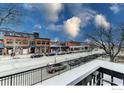 Charming street view showing local businesses with a picturesque sky and mature trees in a walkable neighborhood at 1800 Pearl St # 15, Boulder, CO 80302