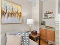 Comfortable living room with stylish side table, lighting, decor and hardwood flooring at 2014 Pintail Dr, Longmont, CO 80504