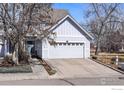 Charming two-story home featuring a two-car garage and a well-maintained front yard in a friendly neighborhood at 2201 Watersong Cir, Longmont, CO 80504