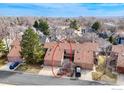 Aerial view of attached townhomes with private garages, mature trees, and well-maintained lawns at 3076 Fulton Cir, Boulder, CO 80301