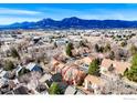 Scenic aerial view showcases the homes and the mountain landscape at 3076 Fulton Cir, Boulder, CO 80301