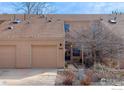 Inviting townhome featuring a one-car garage and a covered front entry at 3076 Fulton Cir, Boulder, CO 80301