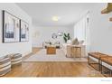 Inviting living room with hardwood floors, neutral decor, plush seating, and ample natural light at 7599 Concord Dr, Boulder, CO 80301
