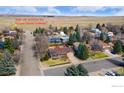 Aerial view of home near Boulder County Trailhead in quiet neighborhood with mature trees and beautiful views at 7733 Cornwall Cir, Boulder, CO 80301