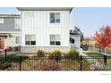 Two-story home features landscaping, fencing, and a manicured lawn at 784 Stonebridge Dr, Longmont, CO 80503