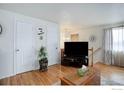 Bright living room featuring hardwood floors and a cozy atmosphere with natural light at 1420 Hover St # 2, Longmont, CO 80501